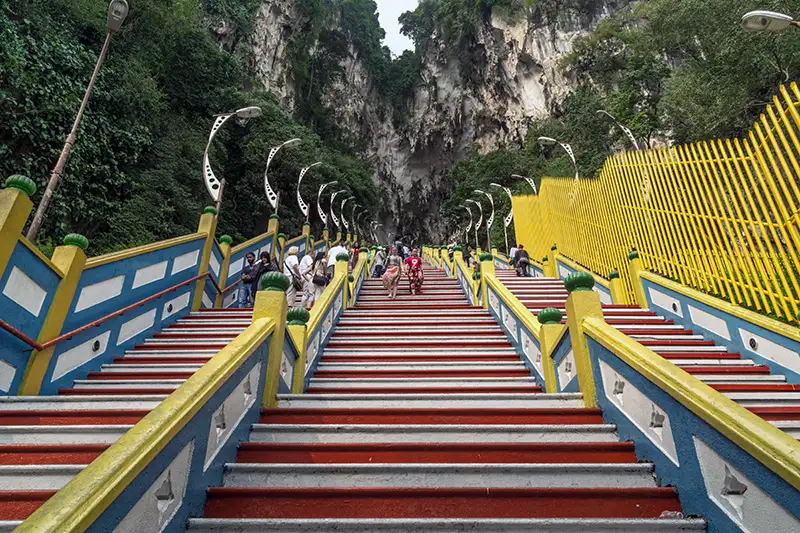 The iconic 272 steps at Batu Caves in 2013, painted in yellow, white, and red, led to the Temple Cave in Kuala Lumpur.