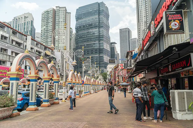 Vibrant Little India Brickfields in Kuala Lumpur with colorful arches and bustling streets