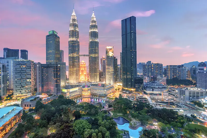 Petronas Twin Towers at dusk one of most popular places to visit in Malaysia