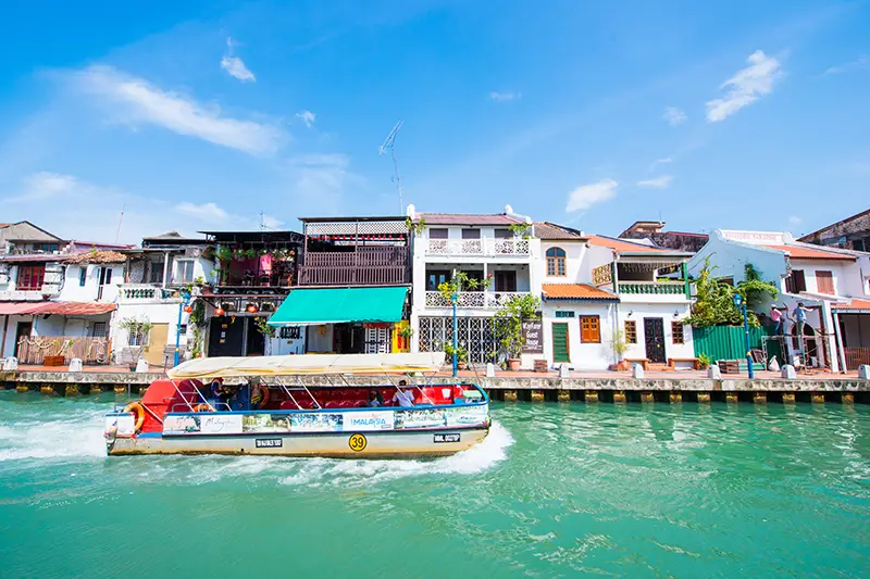 "Malacca River Cruise, one of the best things to do in Malacca, offering scenic views of heritage buildings and vibrant street art.