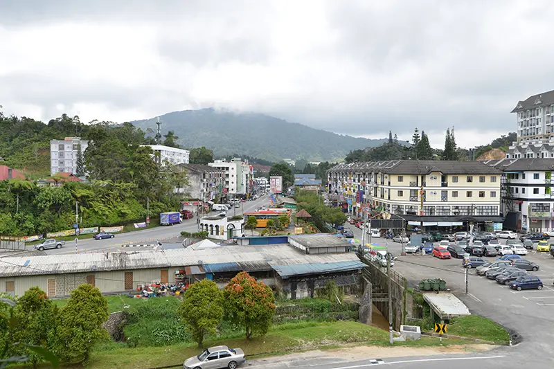 Scenic view of Tanah Rata town in Cameron Highlands with hotels, shops, and restaurants—popular area for places to stay in Cameron Highlands